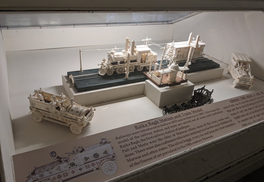 Ivory carvings of trains and cars