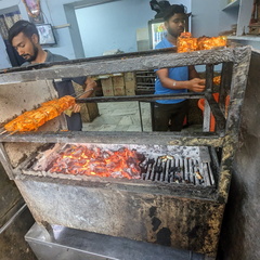 Restaurant workers grilling food