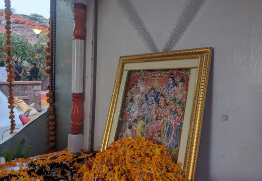 A religious image with marigold flowers