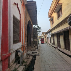 A narrow street with buildings on either side