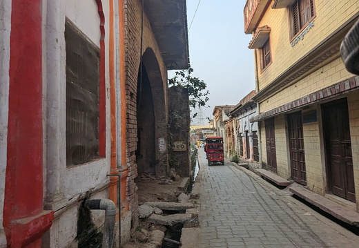 A narrow street with buildings on either side