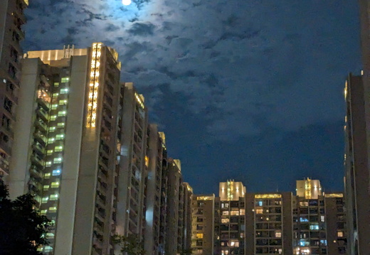 Moonlit cityscape at night